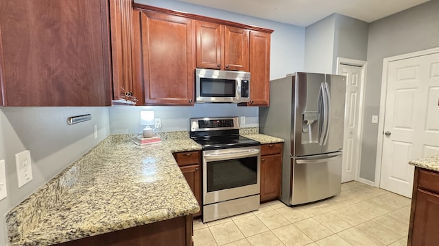 115 Hyrne Dr, Goose Creek, SC 29445 - kitchen featuring stainless steel appliances, light tile patterned floors, and light stone countertops