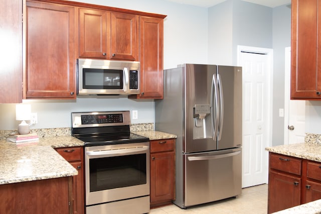 115 Hyrne Dr, Goose Creek, SC 29445 - kitchen with appliances with stainless steel finishes, light stone counters, and light tile patterned flooring