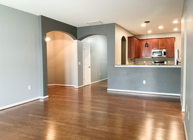 115 Hyrne Dr, Goose Creek, SC 29445 - kitchen with stainless steel microwave, dark wood-type flooring, baseboards, decorative light fixtures, and recessed lighting