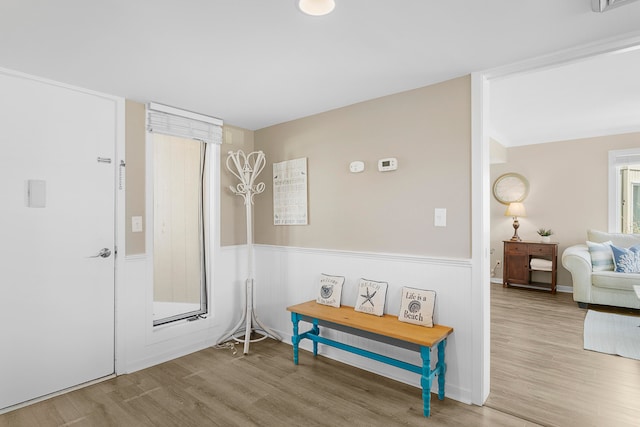 hallway with hardwood / wood-style flooring