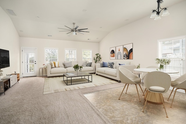 living room featuring visible vents, a ceiling fan, a wealth of natural light, and carpet flooring