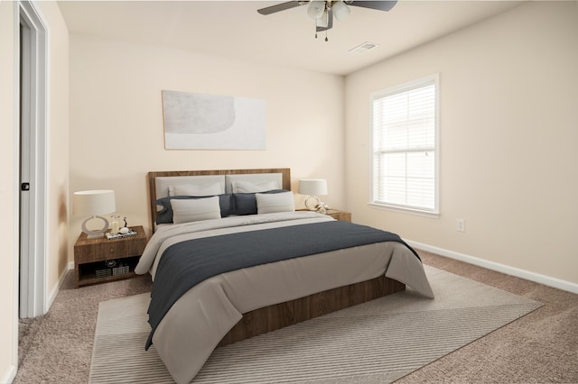 bedroom with a ceiling fan, carpet, visible vents, and baseboards