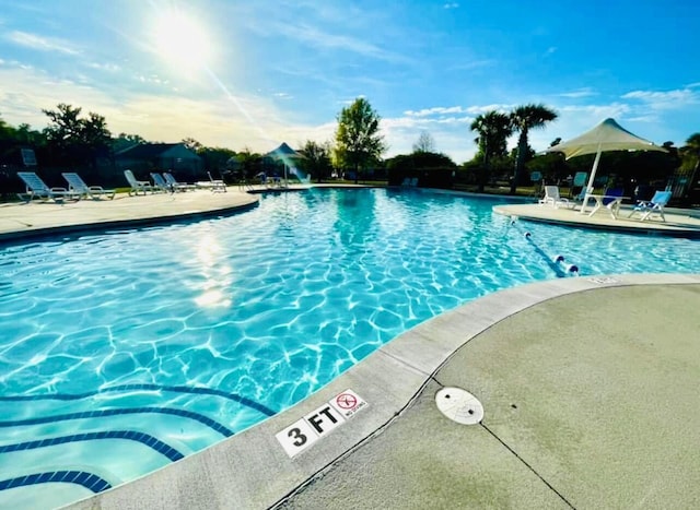 community pool with a patio area