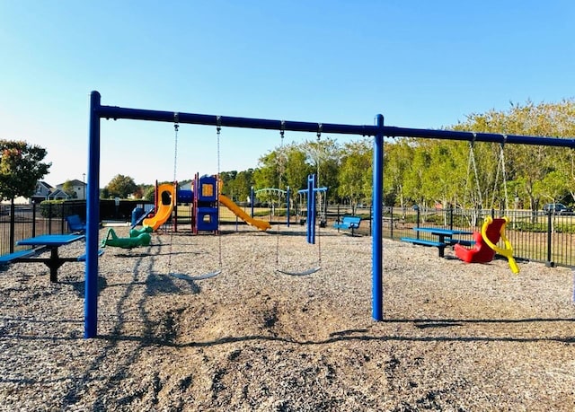 community jungle gym featuring fence