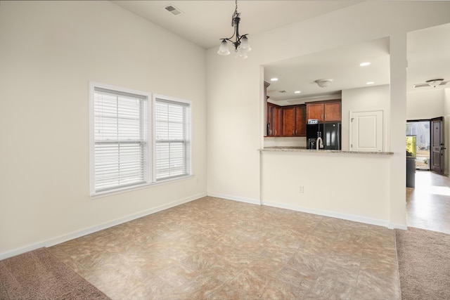 unfurnished living room featuring recessed lighting, visible vents, and baseboards