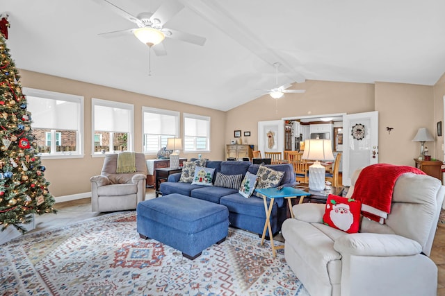 living room with lofted ceiling with beams and ceiling fan