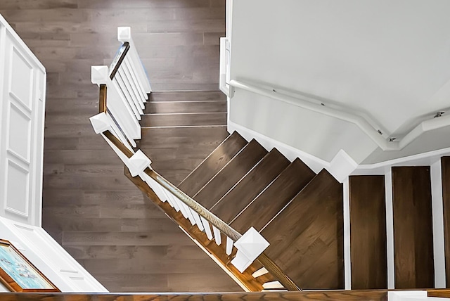 staircase with wood walls