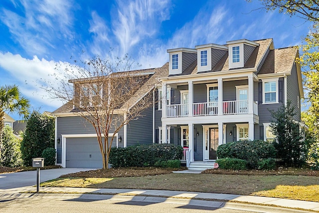 view of front of house with a balcony and a garage