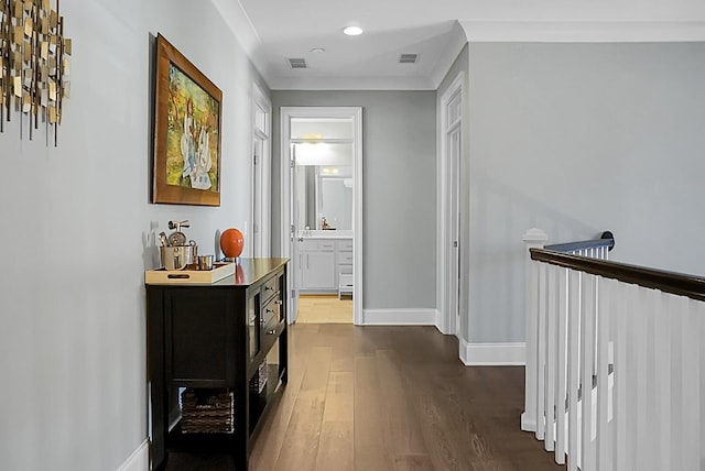 corridor featuring dark hardwood / wood-style floors and ornamental molding