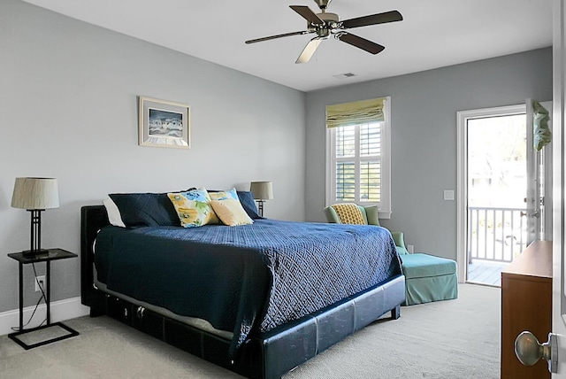 carpeted bedroom featuring access to exterior and ceiling fan