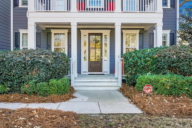 entrance to property with a balcony