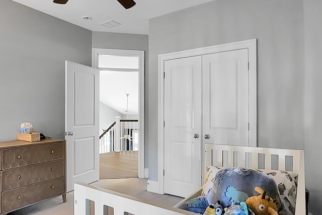 bedroom featuring ceiling fan and a closet