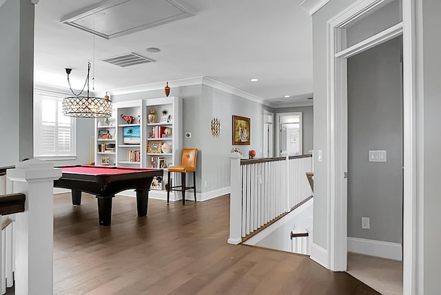 game room featuring dark hardwood / wood-style floors, crown molding, and billiards