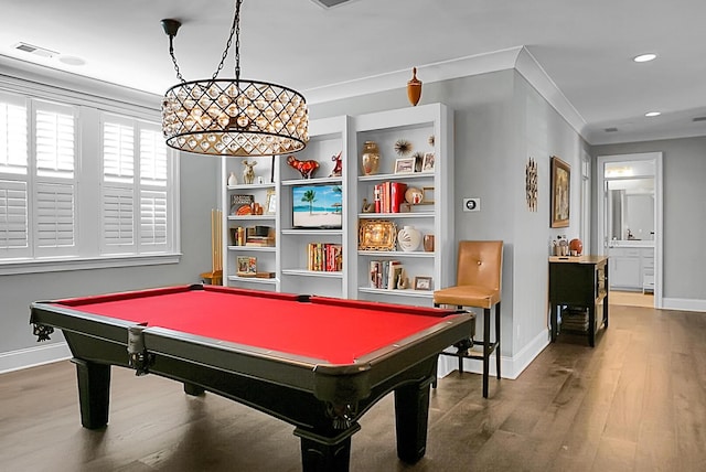 game room featuring hardwood / wood-style flooring, built in features, ornamental molding, and pool table