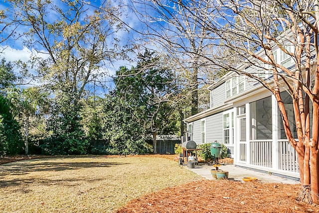 view of yard featuring a sunroom