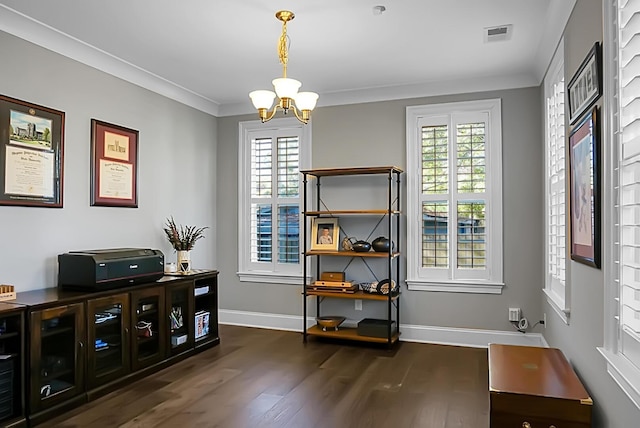 interior space with dark hardwood / wood-style flooring, crown molding, and a chandelier