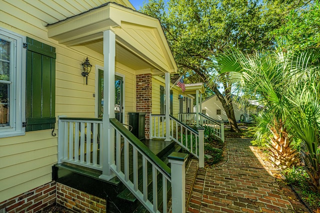 doorway to property featuring covered porch