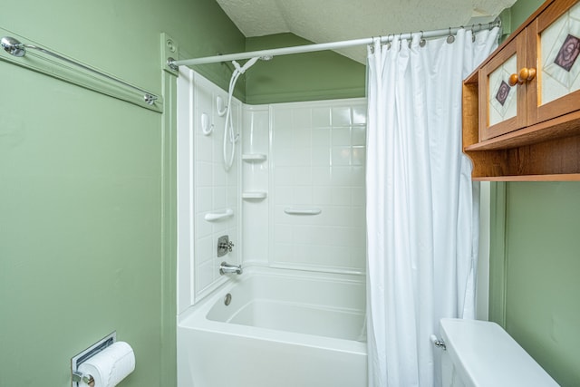 bathroom with shower / bathtub combination with curtain, vaulted ceiling, a textured ceiling, and toilet