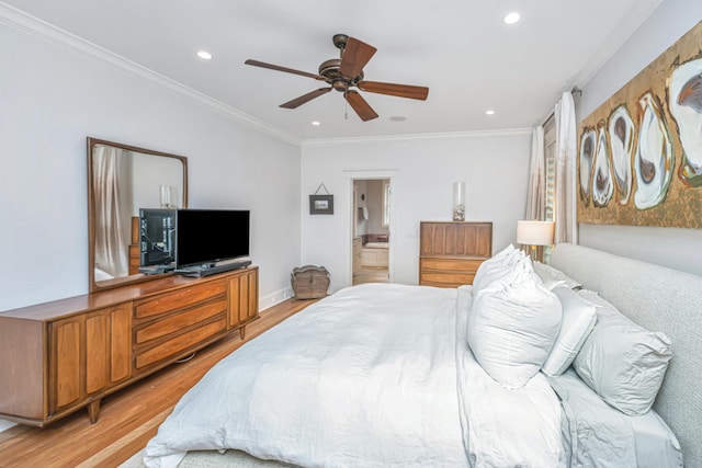 bedroom featuring ensuite bathroom, recessed lighting, crown molding, and light wood-type flooring