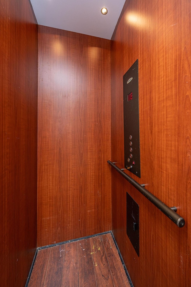 room details with elevator and wood finished floors