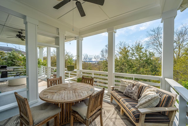 sunroom featuring ceiling fan