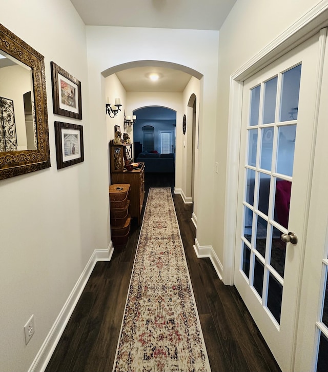 hall with dark wood-type flooring