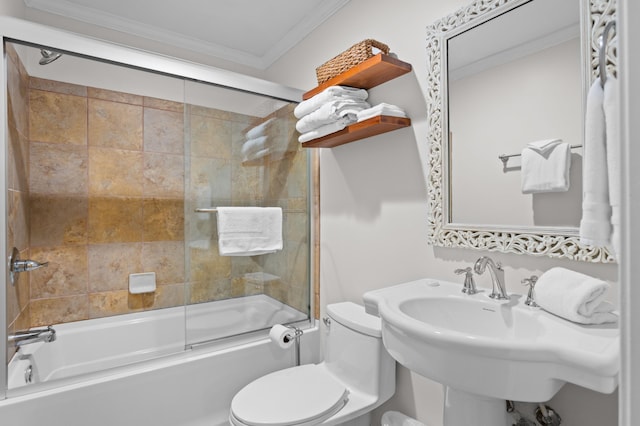 full bathroom featuring a sink, toilet, crown molding, and shower / bath combination with glass door