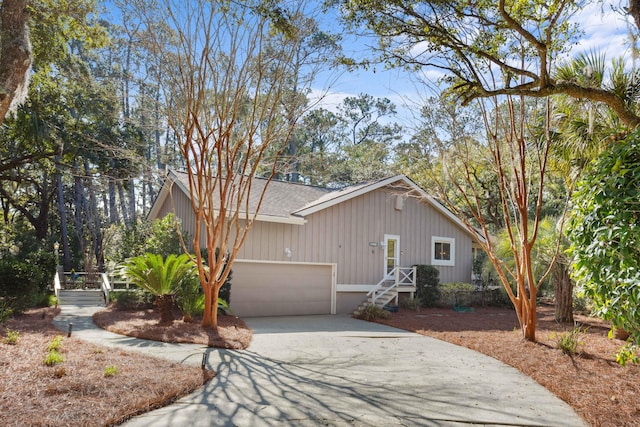 view of front of house featuring a garage and concrete driveway