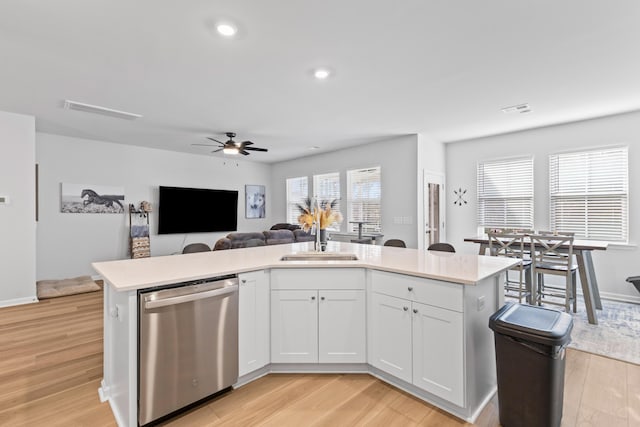 68 Red Bluff St, Summerville, SC 29483 - kitchen with stainless steel dishwasher, a sink, light wood finished floors, visible vents, and ceiling fan