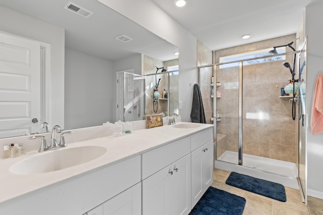 68 Red Bluff St, Summerville, SC 29483 - bathroom featuring double vanity, a sink, a stall shower, and visible vents
