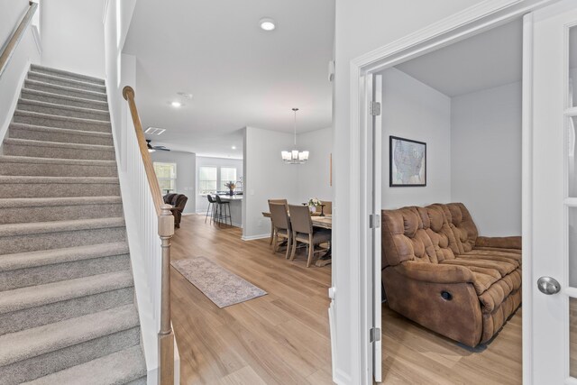 68 Red Bluff St, Summerville, SC 29483 - interior space featuring baseboards, wood finished floors, recessed lighting, and an inviting chandelier
