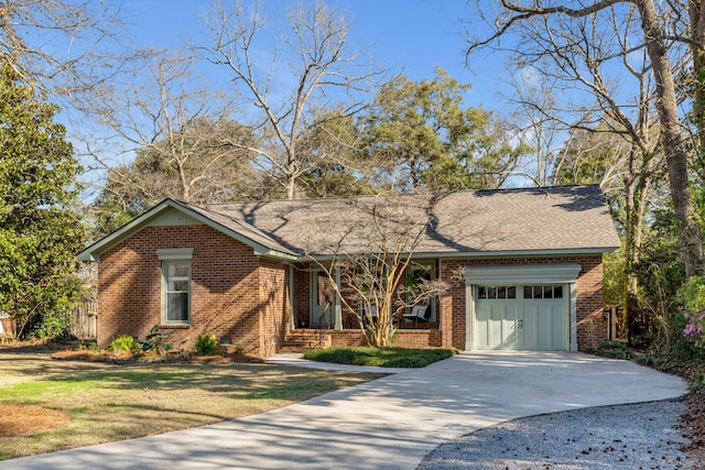 ranch-style house with brick siding, a front yard, roof with shingles, driveway, and an attached garage