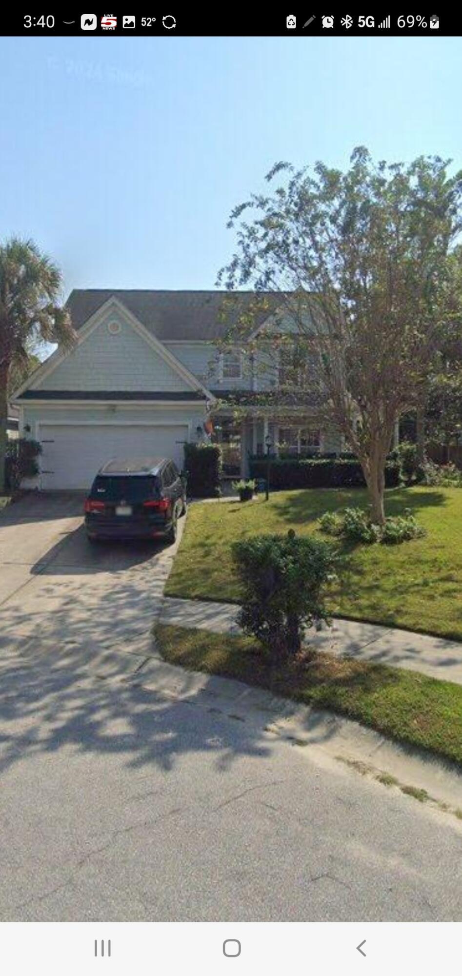 view of front of home featuring a garage and a front lawn