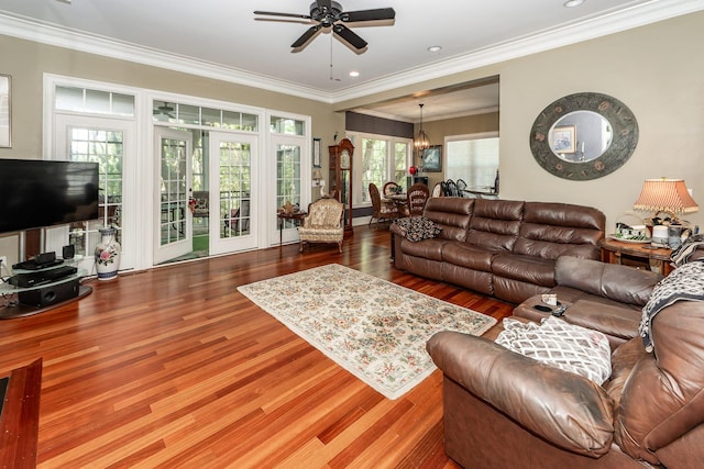 living area featuring ornamental molding, a ceiling fan, recessed lighting, and wood finished floors