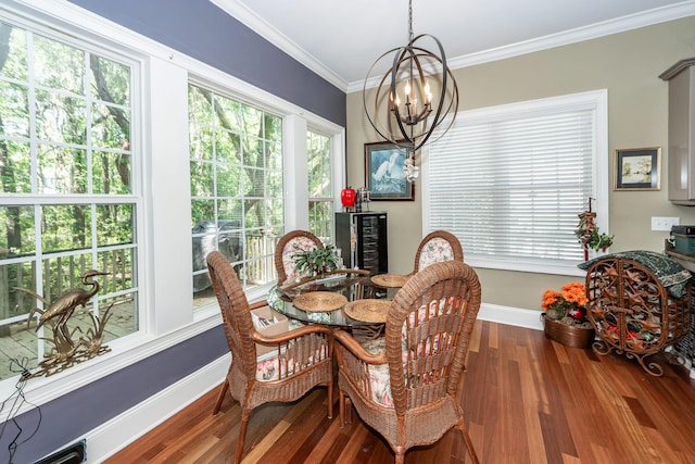 dining space featuring ornamental molding, wood finished floors, baseboards, beverage cooler, and a notable chandelier
