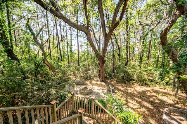 view of yard featuring a forest view