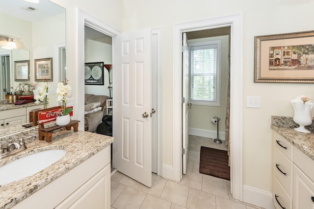 full bathroom featuring tile patterned floors, visible vents, baseboards, and vanity