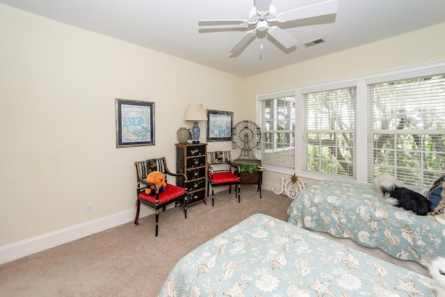 bedroom featuring carpet floors, baseboards, ceiling fan, and visible vents
