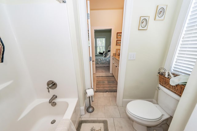 bathroom featuring tile patterned floors, shower / bathing tub combination, and toilet