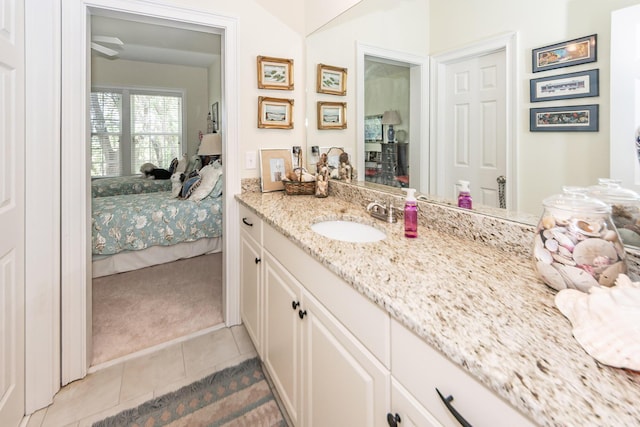 ensuite bathroom featuring tile patterned floors, ensuite bathroom, and vanity