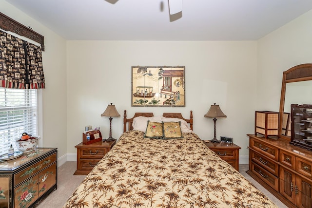 bedroom featuring baseboards, carpet, and a ceiling fan