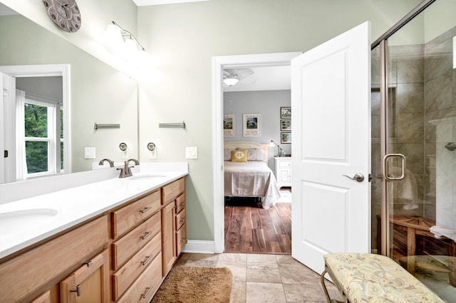 1064 Blackbear Dr, Edisto Island, SC 29438 - ensuite bathroom featuring double vanity, a shower stall, and tile patterned flooring
