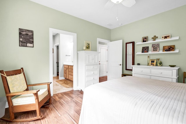1064 Blackbear Dr, Edisto Island, SC 29438 - bedroom with light wood finished floors, ensuite bath, and a ceiling fan