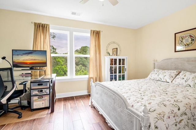 1064 Blackbear Dr, Edisto Island, SC 29438 - bedroom with wood finished floors, an office area, and a ceiling fan