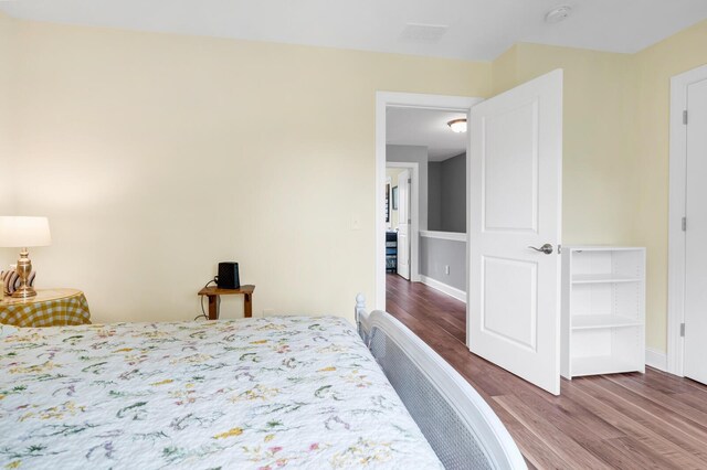 1064 Blackbear Dr, Edisto Island, SC 29438 - bedroom with wood finished floors and baseboards