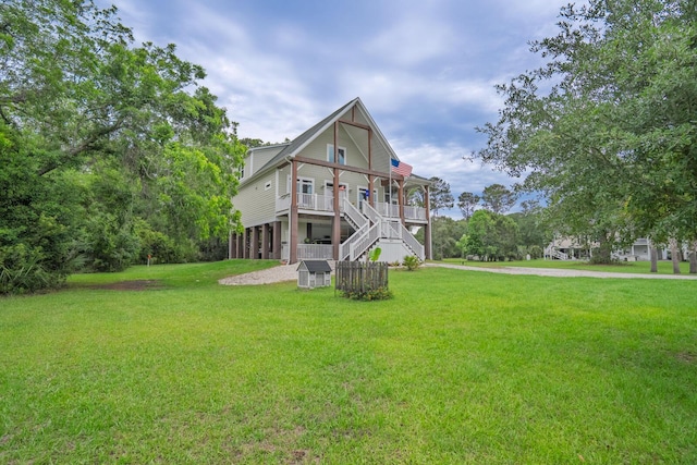 1064 Blackbear Dr, Edisto Island, SC 29438 - view of front of house with a front lawn, stairs, and a porch