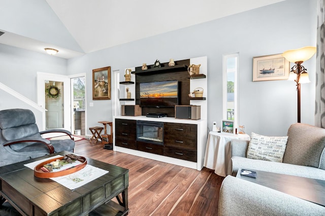 1064 Blackbear Dr, Edisto Island, SC 29438 - living area featuring dark wood-type flooring, vaulted ceiling, and stairway