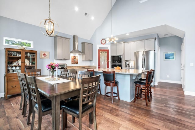 1064 Blackbear Dr, Edisto Island, SC 29438 - dining area with a chandelier, high vaulted ceiling, and dark wood-type flooring