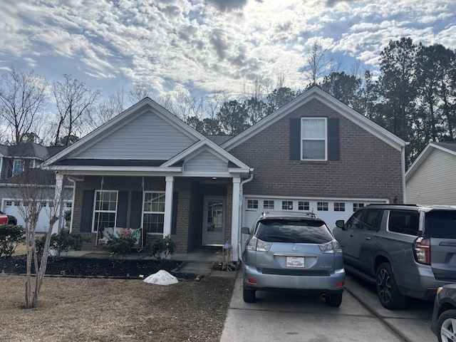 view of front of property with a garage and covered porch