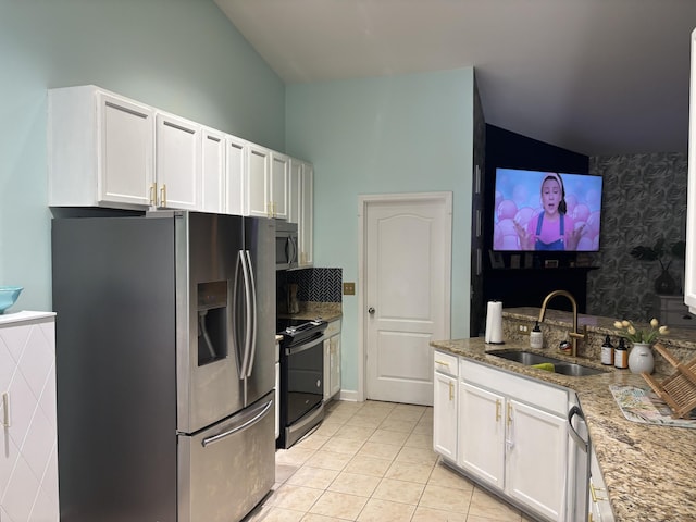 kitchen featuring white cabinetry, sink, light stone counters, and stainless steel appliances